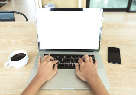 close-up hand typing keyboard computer in office place