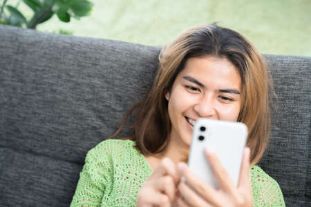 focus on smile woman dental braces using phone mobile, orthodontic treatment