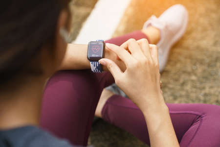 close-up sport women check on her smart watchの写真素材