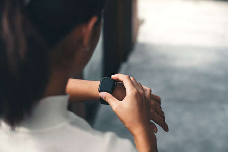 women checking on smart watchの写真素材