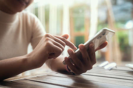 A smile woman using smart phoneの写真素材