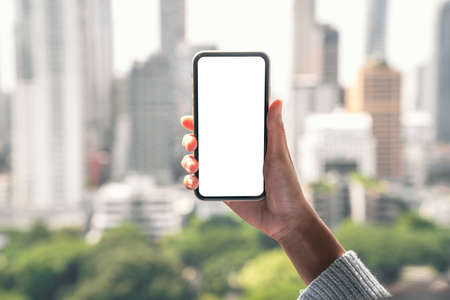 hand holding phone mobile white blank screenの写真素材