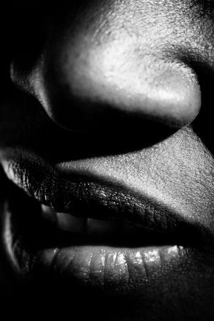 extreme closeup of the nose and mouth of a womanの写真素材