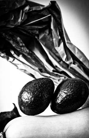 two avocados on a butternut squash
