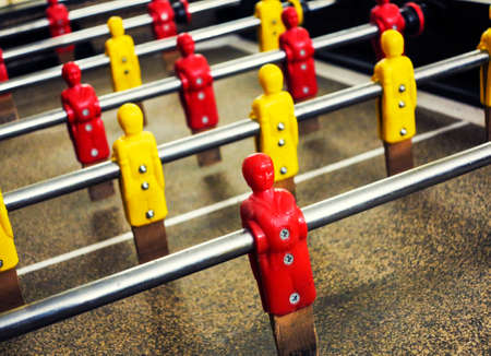 Close-up on the players of a table football gameの写真素材