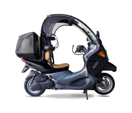 Black enclosed scooter isolated on whiteの写真素材
