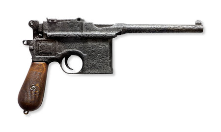 Old pistol isolated on whiteの写真素材