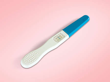 Close up pregnancy test isolated on pink