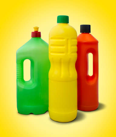Cleaning products on yellow background