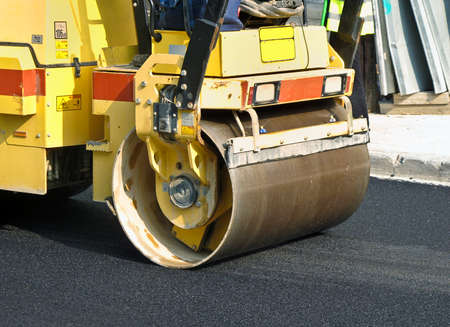 Compactor roller at asphalting work