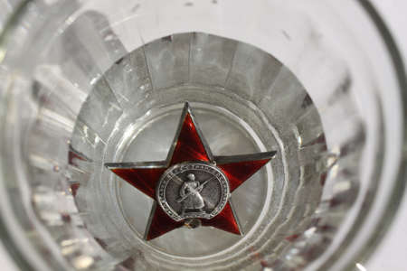 Soviet order Red Star in grassの写真素材