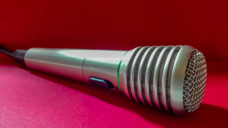 pop wireless microphone on a red backgroundの写真素材