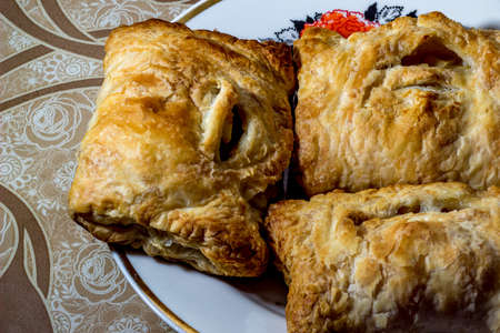 homemade cakes on a white plate, and brown tableclothの写真素材