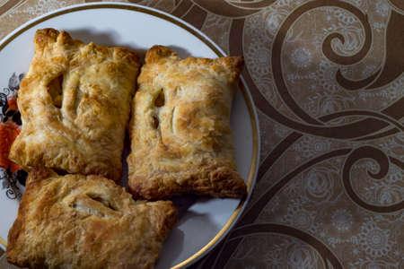 homemade cakes on a white plate, and brown tableclothの写真素材