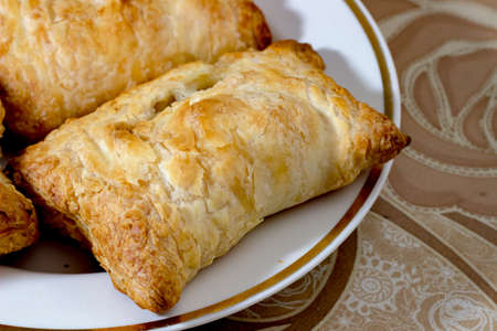 homemade cakes on a white plate, and brown tableclothの写真素材