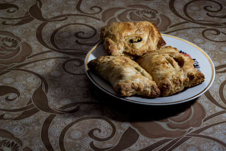 homemade cakes on a white plate, and brown tableclothの写真素材