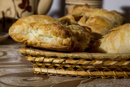 homemade cakes on a white plate, and brown tableclothの写真素材