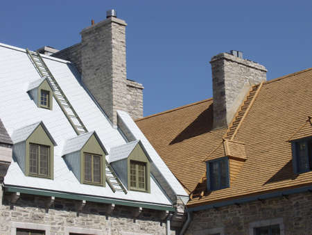 Roofs of two traditional stone houses in the of Old Quebec City, Quebec, Canada.の写真素材