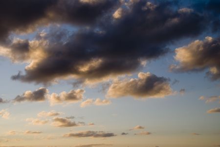 Banks of cumulus clouds at sunset.