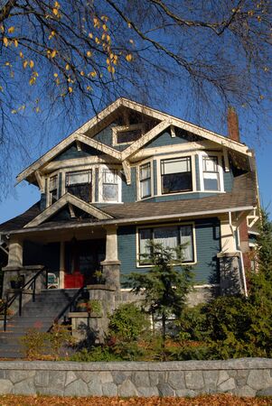 A Craftsman Style house in autumn.の写真素材