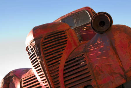 The grille of an old red truck.の写真素材