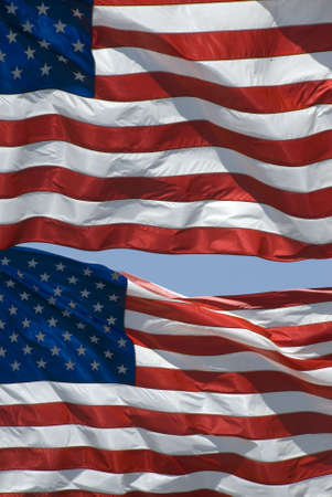 Two contemporary US flags (50 stars) flying together.の写真素材