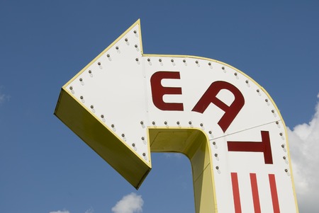 A three-dimensional metal EAT sign in a sans-serif typeface.の写真素材