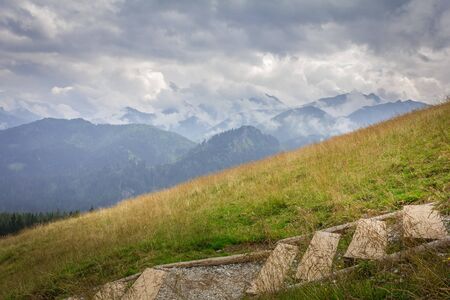 Poland. Tatra Mountains. View of the Tatra peaks. Mountain hiking trail, stairs.の写真素材