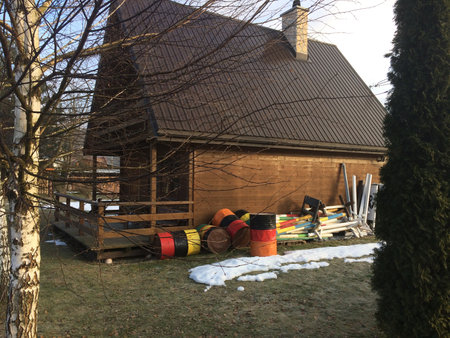 Wooden house and empty barrelsの写真素材