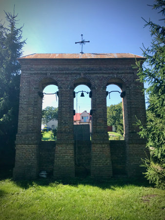 Historic bell tower covered with tilesの写真素材