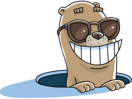 A happy cartoon groundhog pokes its head from a hole wearing sunglasses.の写真素材