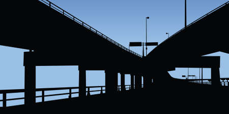 A highway running under overpasses on a raised highway の写真素材