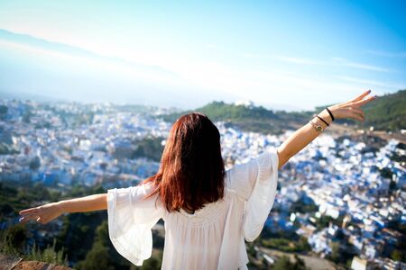 Girl enjoying the panoramic views of chefchaouenの写真素材
