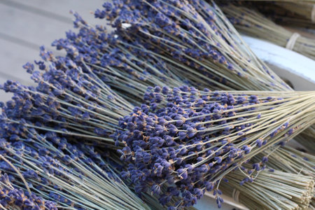 small bouquets of lavender on a wooden tableの写真素材