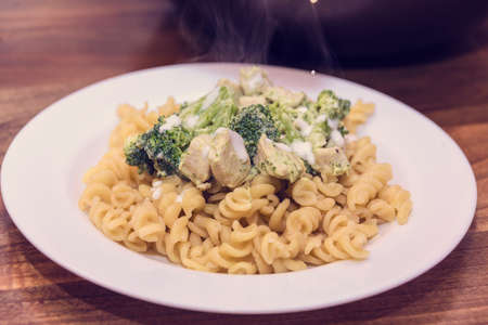 Macaroni with broccoli and chicken breastの写真素材