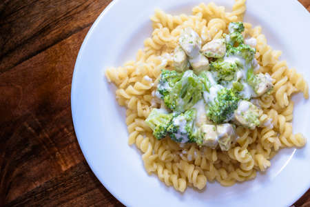 Macaroni with broccoli and chicken breastの写真素材