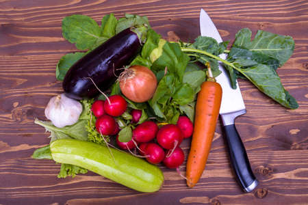 various vegetables on a wooden boardの写真素材