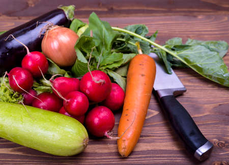 various vegetables on a wooden boardの写真素材