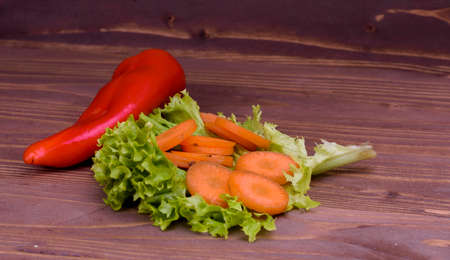 various vegetables on a wooden boardの写真素材