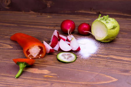 various vegetables on a wooden boardの写真素材