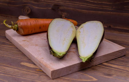 cutting the eggplant on a wooden boardの写真素材