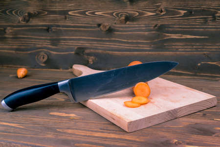 cutting the carrot on a wooden board