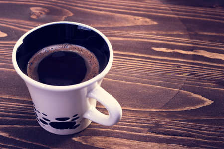 Coffee cups on a wooden background