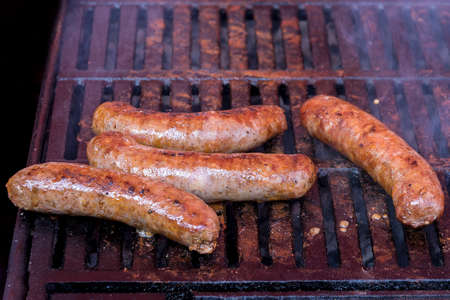homemade sausages roasted in barbecue and in oilの写真素材