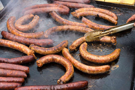 homemade sausages roasted in barbecue and in oilの写真素材