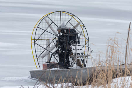 boat for a swamp in frozen waterの写真素材