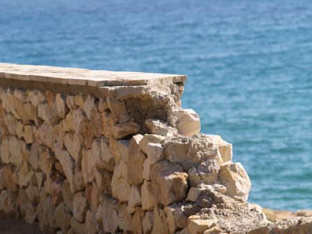 Ruined stone railing against the sea