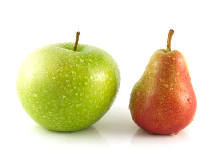 Ripe red pear with green apple on white background (water drops). Isolated fruit. Healthy fruit with vitamins.の写真素材