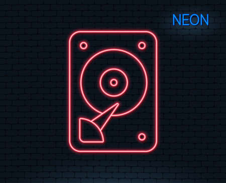 Neon light. HDD icon. Hard disk storage sign. Hard drive memory symbol. Glowing graphic design. Brick wall. Vectorのイラスト素材