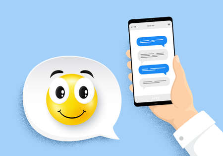 Hand holding phone with online messages. Smartphone with chatting bubbles. Happy smile face. Speech...